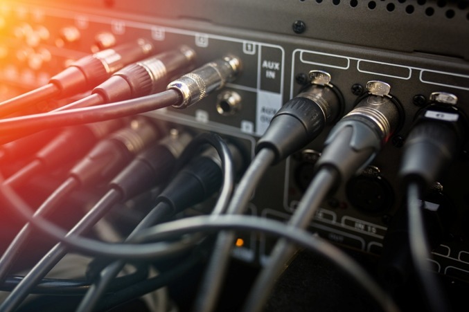 a patch panel with XLR cables connected to it
