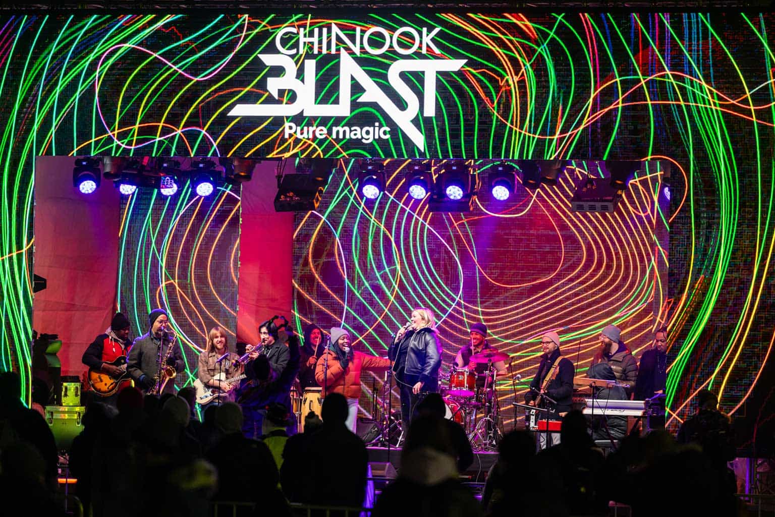a stage with a band playing music together on it
