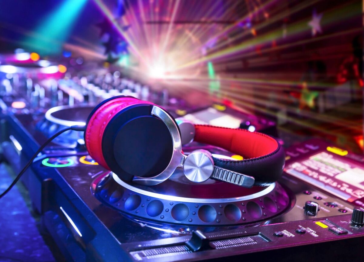 a CDJ with a pair of headphones on top