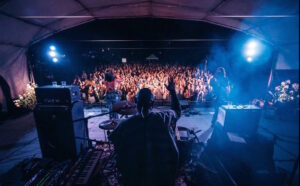 a band playing in front of a crowd